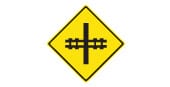 Railway crossing ahead. Be alert for trains. This sign also shows the angle at which the railway tracks cross the road